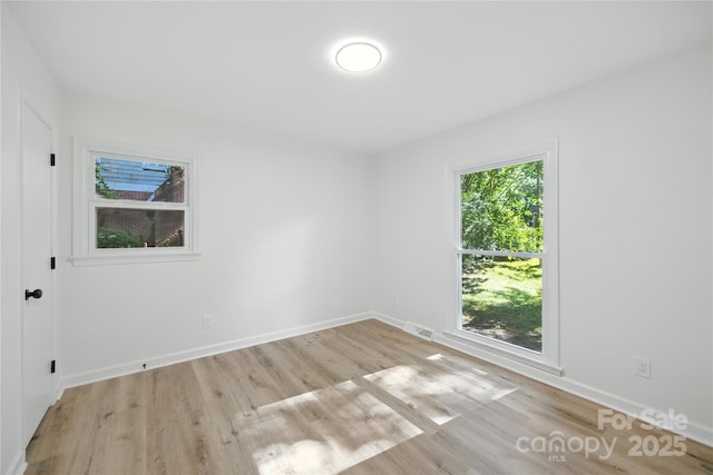 6127 Eagle Peak Dr, Charlotte, NC 28214 - spare room with wood finished floors and baseboards