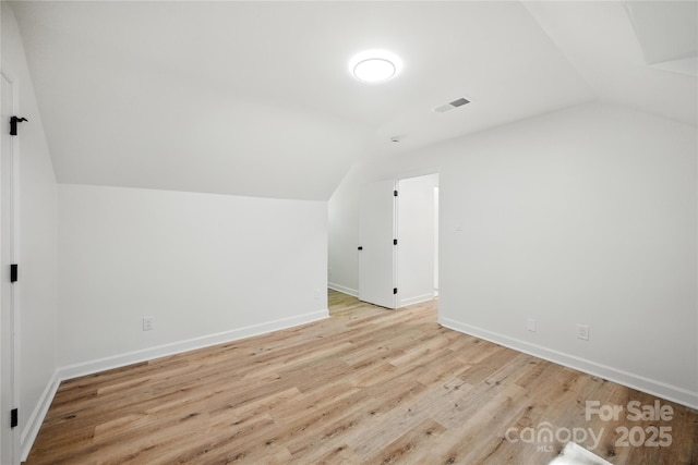 6127 Eagle Peak Dr, Charlotte, NC 28214 - additional living space featuring lofted ceiling and light wood-style floors