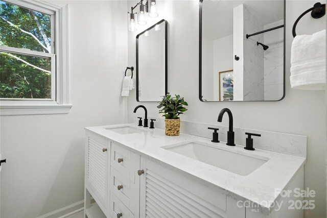 6127 Eagle Peak Dr, Charlotte, NC 28214 - bathroom featuring double vanity and a shower