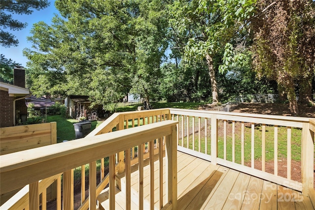 6127 Eagle Peak Dr, Charlotte, NC 28214 - wooden deck featuring a lawn and view of wooded area