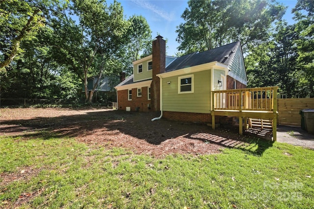 6127 Eagle Peak Dr, Charlotte, NC 28214 - back of house with a deck, a chimney, and brick siding