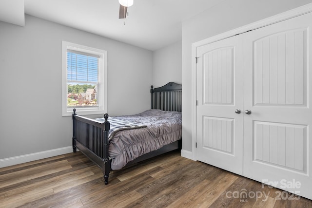 140 Maplewood Ct, Hudson, NC 28638 - bedroom with wood finished floors, baseboards, ceiling fan, and a closet