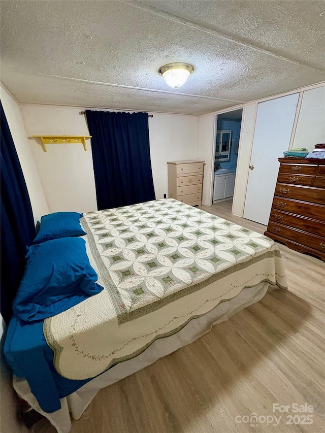 5022 Wrenn Dr, Denver, NC 28037 - bedroom featuring wood finished floors and a textured ceiling