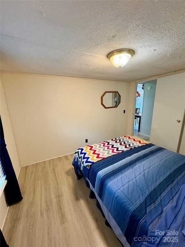 5022 Wrenn Dr, Denver, NC 28037 - bedroom featuring light wood-type flooring and a textured ceiling