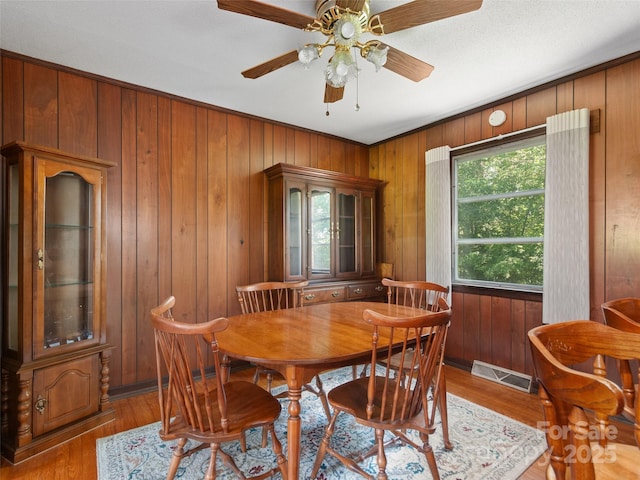 167 Panorama Dr, Franklin, NC 28734 - dining room with wood finished floors, wooden walls, and a ceiling fan