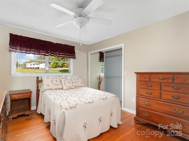 167 Panorama Dr, Franklin, NC 28734 - bedroom featuring light wood-style floors, a closet, baseboards, and a ceiling fan