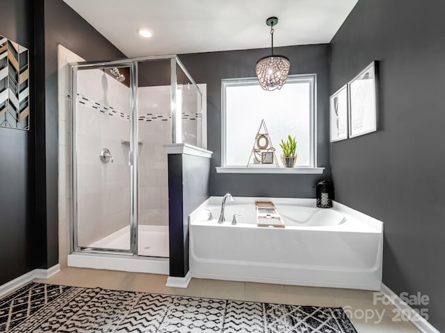417 Livingston Dr, Lancaster, SC 29720 - bathroom with a garden tub, a shower stall, and a chandelier