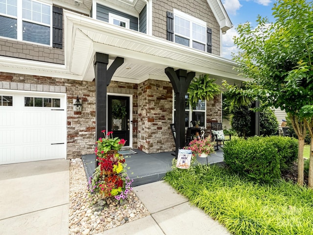 417 Livingston Dr, Lancaster, SC 29720 - doorway to property with a porch, a garage, and stone siding