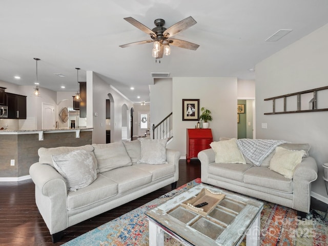 417 Livingston Dr, Lancaster, SC 29720 - living area featuring dark wood-type flooring, arched walkways, a ceiling fan, recessed lighting, and stairway