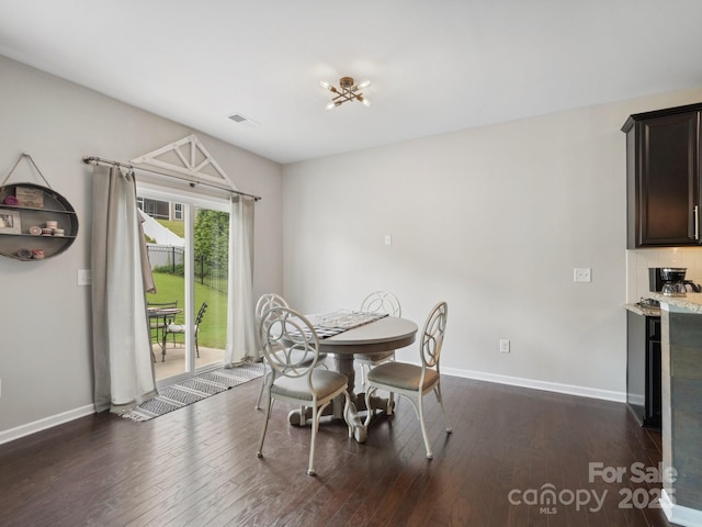 417 Livingston Dr, Lancaster, SC 29720 - dining space featuring dark wood-style flooring and bar