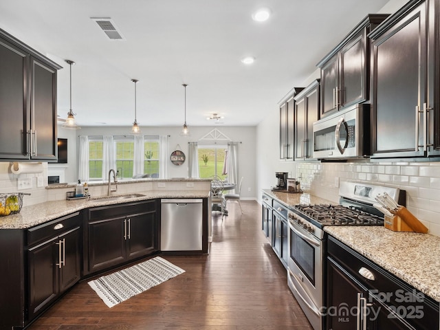 417 Livingston Dr, Lancaster, SC 29720 - kitchen featuring stainless steel appliances, a peninsula, dark wood-style flooring, backsplash, and recessed lighting