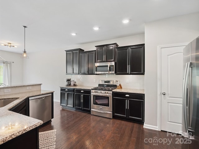 417 Livingston Dr, Lancaster, SC 29720 - kitchen with appliances with stainless steel finishes, dark cabinetry, backsplash, and recessed lighting