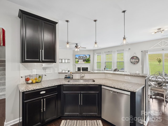 417 Livingston Dr, Lancaster, SC 29720 - kitchen featuring dishwasher, a ceiling fan, a peninsula, dark wood-style flooring, and decorative backsplash