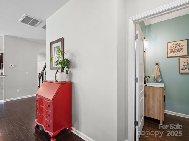 417 Livingston Dr, Lancaster, SC 29720 - hallway with dark wood-type flooring, stairs, and arched walkways