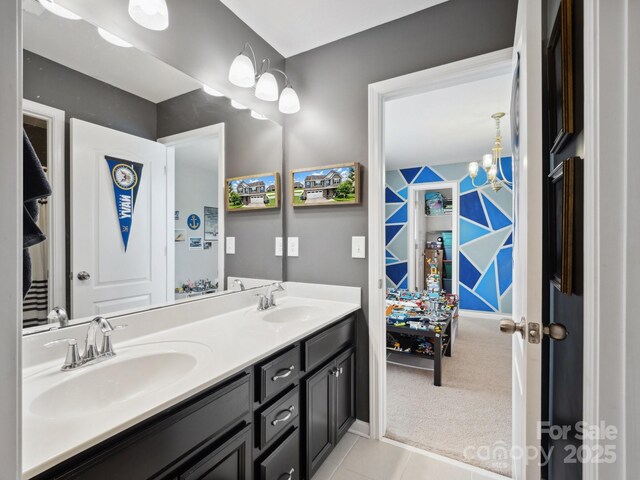 417 Livingston Dr, Lancaster, SC 29720 - full bath featuring double vanity, tile patterned flooring, and a chandelier