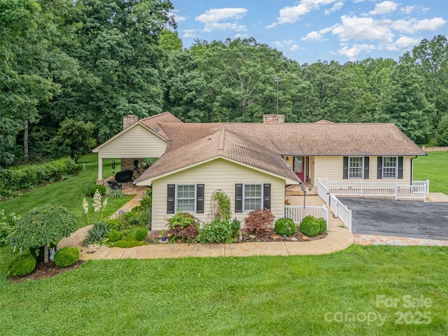 3060 Texs Fish Camp Rd, Connelly Springs, NC 28612 - view of front facade featuring a chimney, a front yard, roof with shingles, a porch, and a wooded view