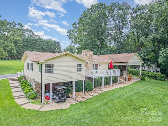 3060 Texs Fish Camp Rd, Connelly Springs, NC 28612 - back of house featuring stairs, a lawn, a chimney, stone siding, and view of scattered trees