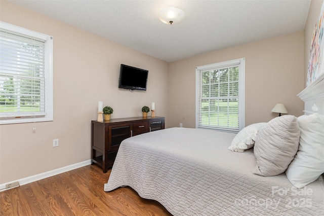 3060 Texs Fish Camp Rd, Connelly Springs, NC 28612 - bedroom featuring wood finished floors and baseboards
