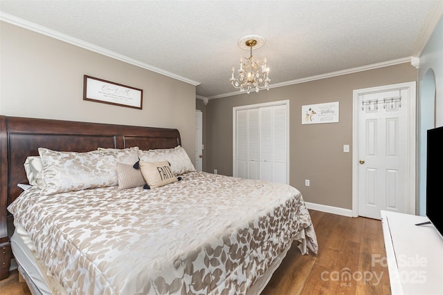 3060 Texs Fish Camp Rd, Connelly Springs, NC 28612 - bedroom with wood finished floors, ornamental molding, a chandelier, a closet, and a textured ceiling