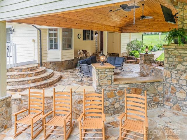 3060 Texs Fish Camp Rd, Connelly Springs, NC 28612 - view of patio / terrace featuring ceiling fan, an outdoor living space, and a bar