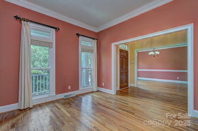 8044 Hawk Crest Ct, Charlotte, NC 28270 - spare room with a chandelier, wood finished floors, and ornamental molding