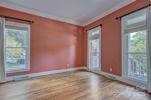 8044 Hawk Crest Ct, Charlotte, NC 28270 - unfurnished room with healthy amount of natural light, light wood-style floors, and crown molding
