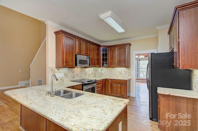 8044 Hawk Crest Ct, Charlotte, NC 28270 - kitchen with stainless steel appliances, a peninsula, light wood-type flooring, backsplash, and glass insert cabinets