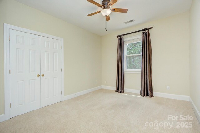 8044 Hawk Crest Ct, Charlotte, NC 28270 - unfurnished bedroom with light carpet, a closet, and ceiling fan