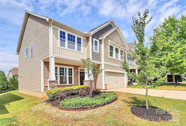 10004 Perth Moor Rd, Charlotte, NC 28278 - craftsman-style house with concrete driveway, a garage, a front yard, and stone siding