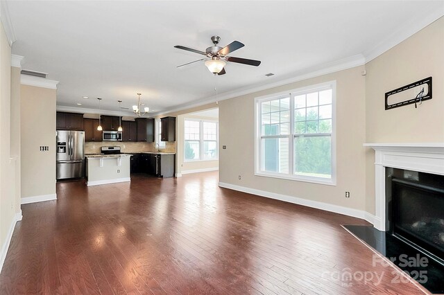 10004 Perth Moor Rd, Charlotte, NC 28278 - unfurnished living room featuring crown molding, ceiling fan, baseboards, and dark wood-style floors