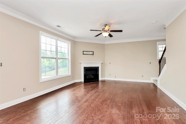 10004 Perth Moor Rd, Charlotte, NC 28278 - unfurnished living room with dark wood-style flooring, a ceiling fan, crown molding, a fireplace with flush hearth, and baseboards