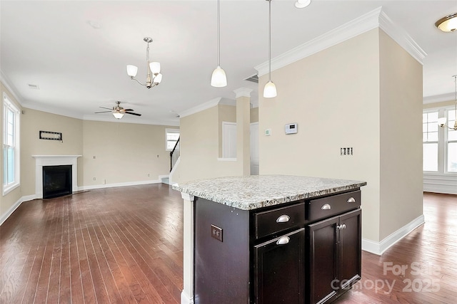 10004 Perth Moor Rd, Charlotte, NC 28278 - kitchen with a chandelier, a ceiling fan, crown molding, dark wood-style floors, and healthy amount of natural light