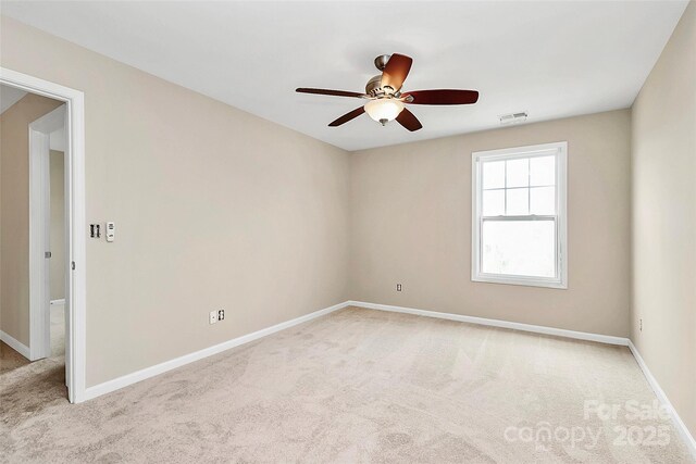 10004 Perth Moor Rd, Charlotte, NC 28278 - spare room with light carpet, ceiling fan, and baseboards