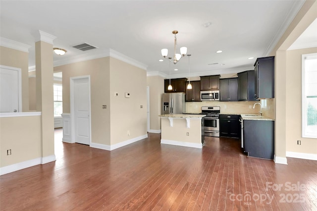 10004 Perth Moor Rd, Charlotte, NC 28278 - kitchen featuring appliances with stainless steel finishes, a sink, a center island, a chandelier, and dark wood-type flooring