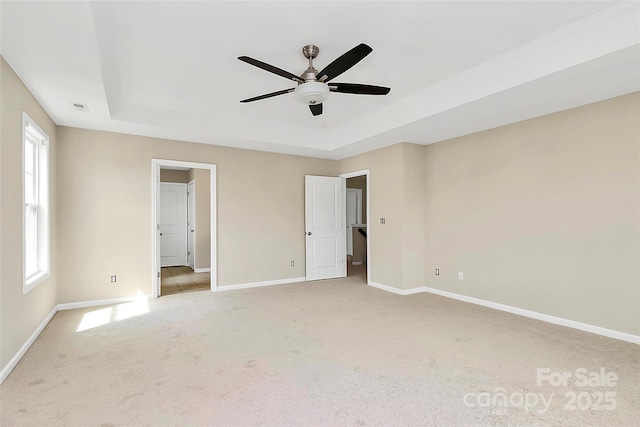10004 Perth Moor Rd, Charlotte, NC 28278 - unfurnished bedroom with a raised ceiling, light carpet, and baseboards