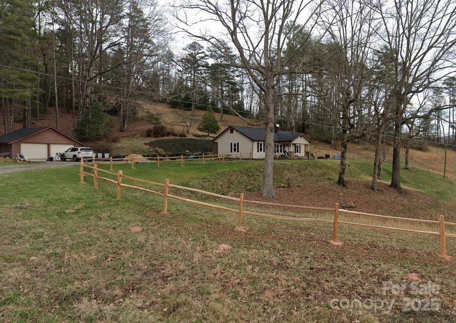 1383 Probart St, Brevard, NC 28712 - view of yard featuring a garage and driveway