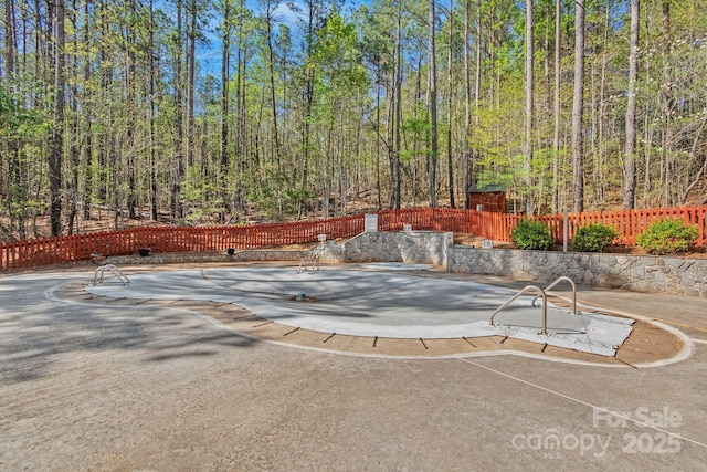 447 Hidden Lake Pkwy, Nebo, NC 28761 - view of swimming pool featuring a forest view