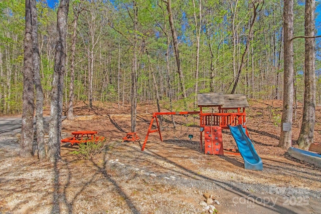 447 Hidden Lake Pkwy, Nebo, NC 28761 - view of play area with a wooded view