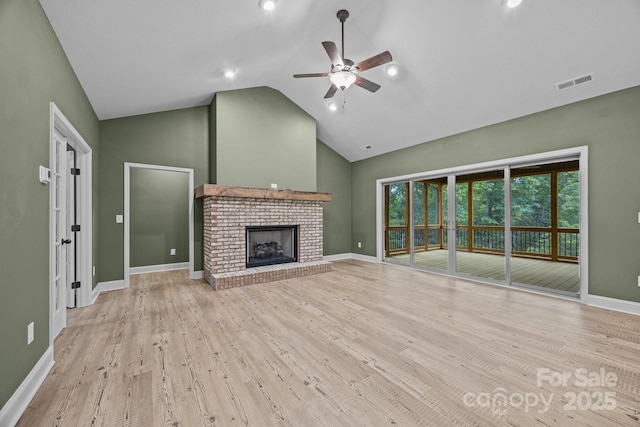 140 Cove Crest Dr, Rutherfordton, NC 28139 - unfurnished living room featuring ceiling fan, wood finished floors, high vaulted ceiling, a fireplace, and baseboards