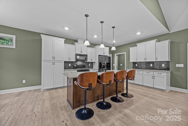 140 Cove Crest Dr, Rutherfordton, NC 28139 - kitchen with black appliances, light wood-style floors, backsplash, and recessed lighting