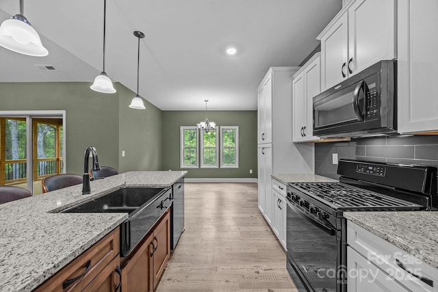 140 Cove Crest Dr, Rutherfordton, NC 28139 - kitchen featuring black appliances, a sink, decorative backsplash, light wood-style flooring, and white cabinets
