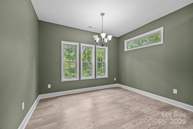 140 Cove Crest Dr, Rutherfordton, NC 28139 - spare room featuring baseboards, a chandelier, and wood finished floors