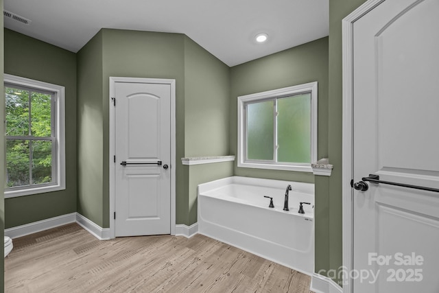 140 Cove Crest Dr, Rutherfordton, NC 28139 - bathroom featuring wood finished floors, a bath, and baseboards