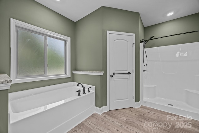 140 Cove Crest Dr, Rutherfordton, NC 28139 - full bathroom with wood finished floors, a garden tub, a shower, and baseboards