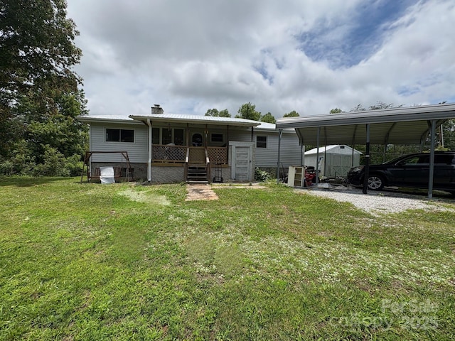 78 Moffitt Hill Church Rd, Old Fort, NC 28762 - back of property with a lawn, a chimney, metal roof, a porch, and a carport
