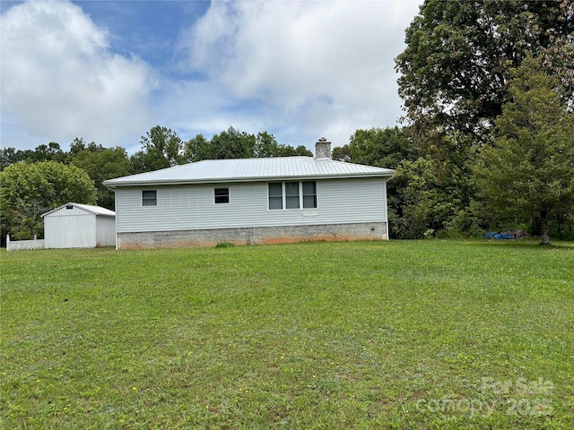 78 Moffitt Hill Church Rd, Old Fort, NC 28762 - view of property exterior featuring a chimney, a lawn, and metal roof
