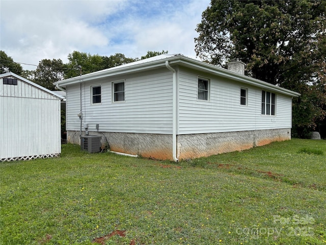 78 Moffitt Hill Church Rd, Old Fort, NC 28762 - view of side of property with central AC, a yard, a chimney, and an outbuilding
