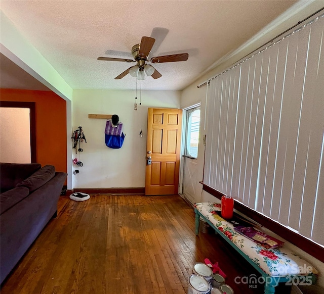 78 Moffitt Hill Church Rd, Old Fort, NC 28762 - living area with hardwood / wood-style floors, a textured ceiling, baseboards, and ceiling fan