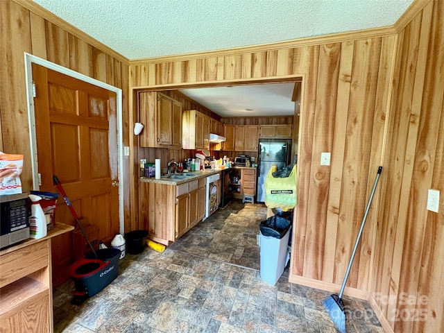 78 Moffitt Hill Church Rd, Old Fort, NC 28762 - kitchen with freestanding refrigerator, a sink, light countertops, wooden walls, and a textured ceiling