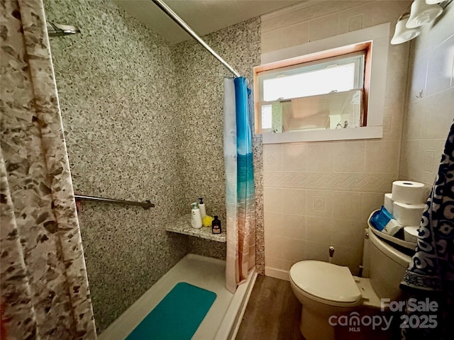 78 Moffitt Hill Church Rd, Old Fort, NC 28762 - bathroom with toilet, a tile shower, tile walls, and wood finished floors